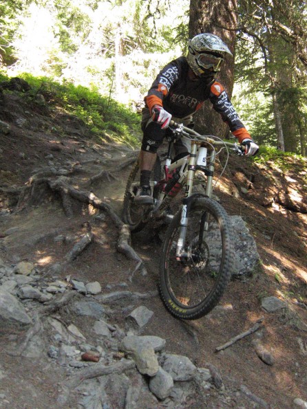 Saracen Myst riding on roots and rocks in La Thuile